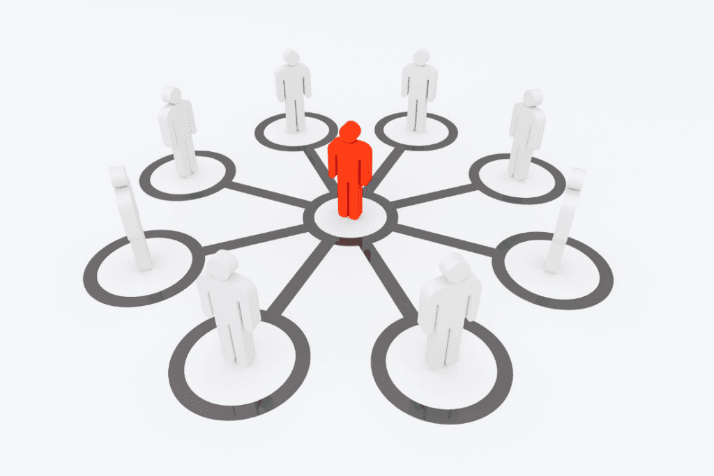 A 3D graphic of a red figure surrounded by several white figures, symbolizing leadership and connection within a network.