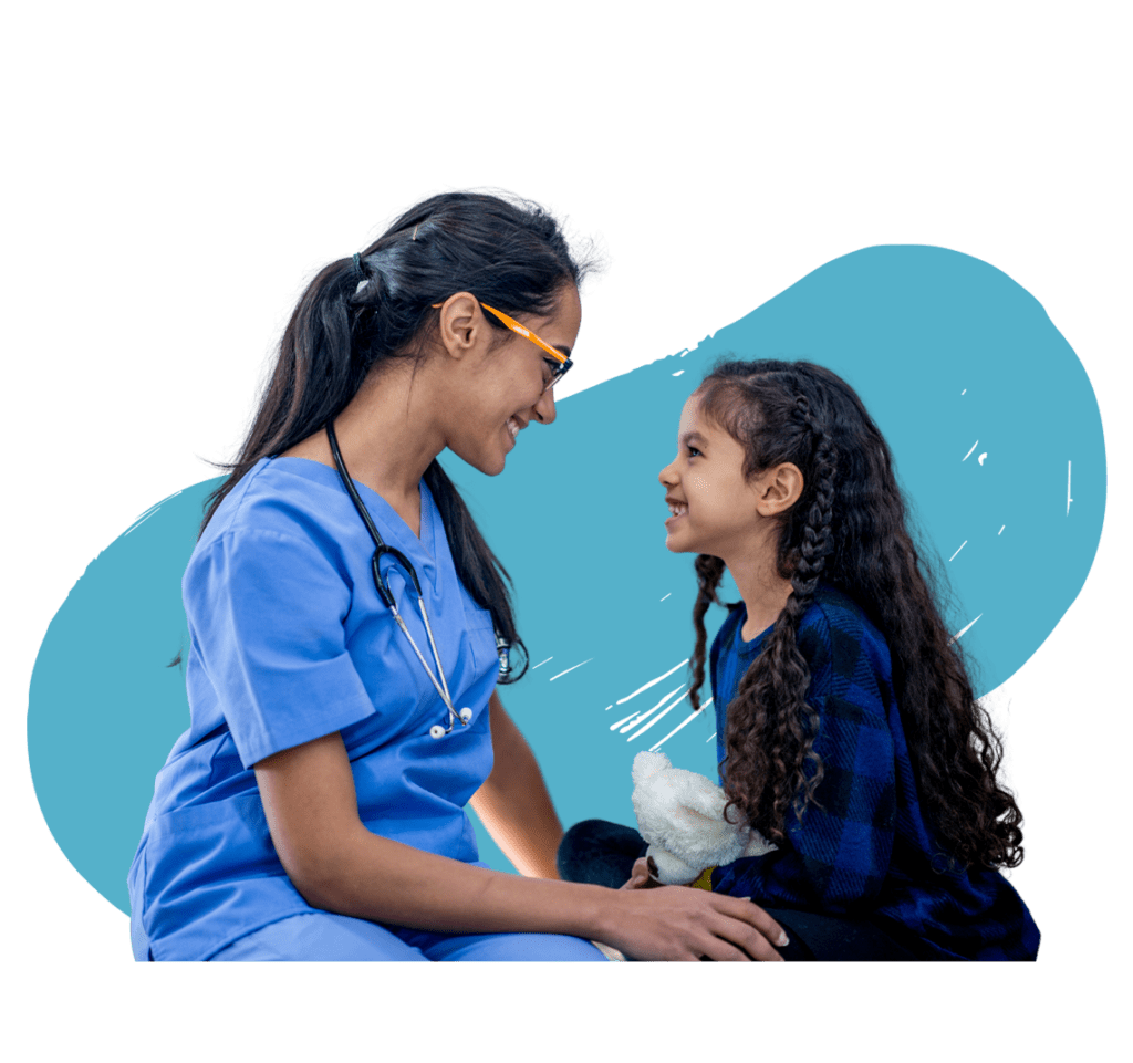 A healthcare professional smiling at a child, highlighting compassionate care in a healthcare setting with light blue background.
