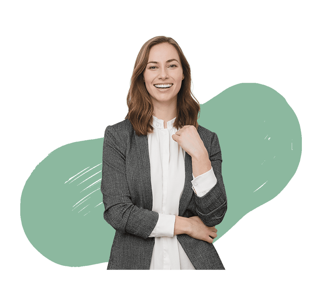 A professional woman wearing a suit, standing with one fist raised, and smiling with an green background.